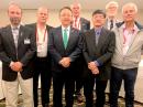 The new IARU Region 2 Executive Committee (L – R): Carlos Beviglia, LU1BCE; Jose Arturo Molina, YS1MS; Ramon Santoyo, XE1KK; Jay Bellows, K0QB; Tommy Chen, 9Y4T; George Gorsline, VE3YV, and Gustavo de Faria Franco, PT2ADM.